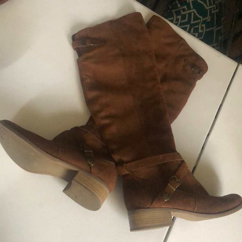 Brown knee high boots.